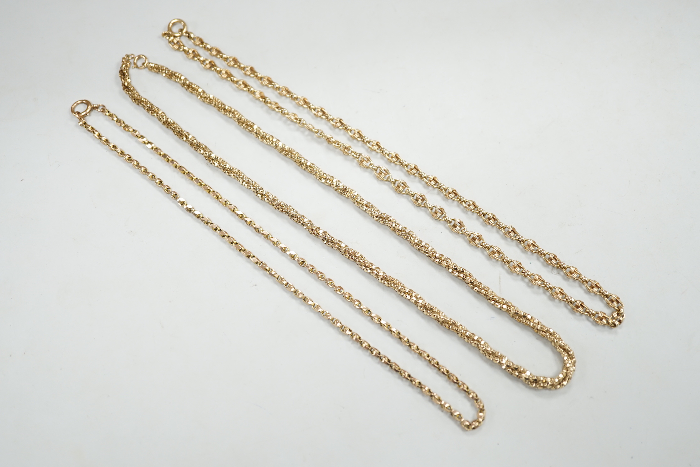 Two 9ct gold chains including triple strand twist, together with a 9c chain, gross weight 34.6 grams.